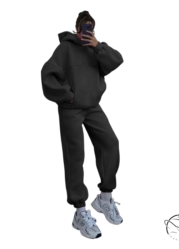 Person in casual comfy sweaters two piece winter solid color set taking mirror selfie