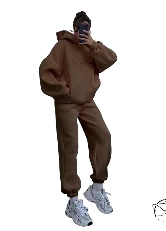 Person in casual comfy sweaters two-piece set taking mirror selfie