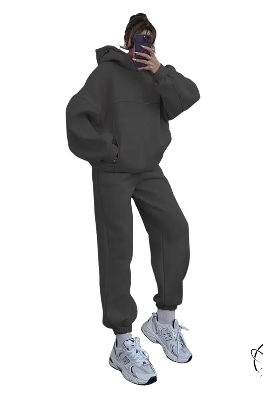 Person in casual comfy sweaters two-piece set taking mirror selfie