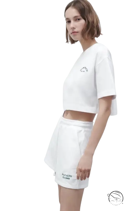 Woman in white crop top and Palo Alto set shorts