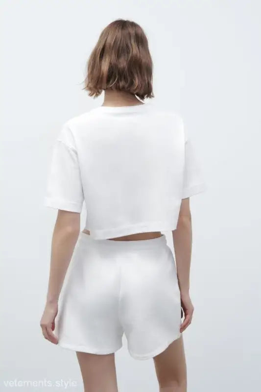 White crop top and shorts set from Palo Alto set styling featuring text flock shorts