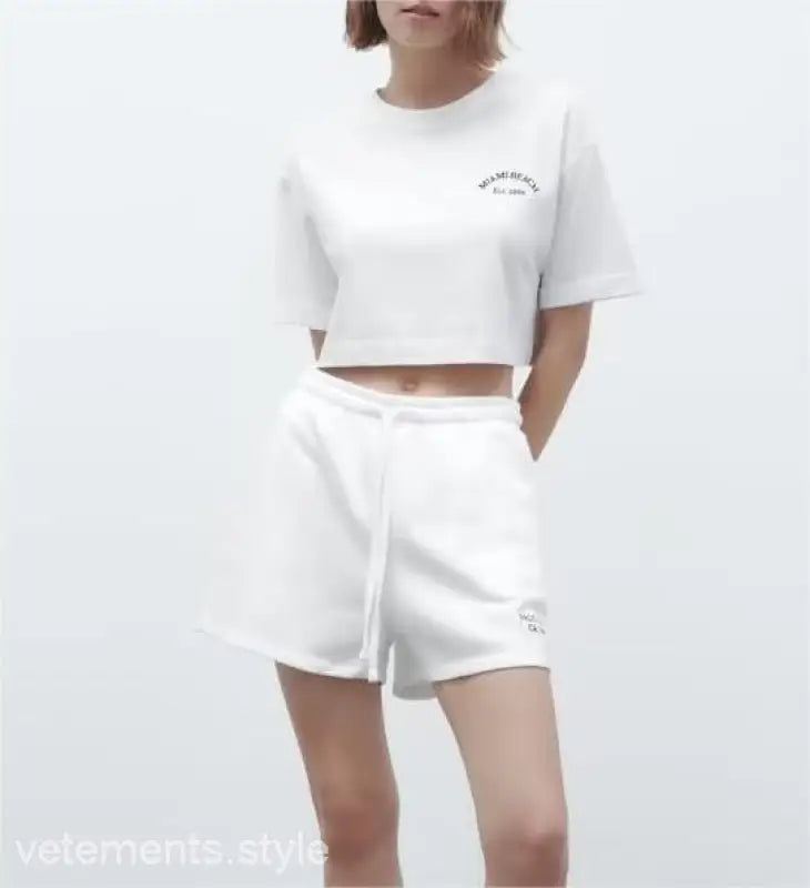 White crop top and shorts set from the Palo Alto set styling with text flock shorts
