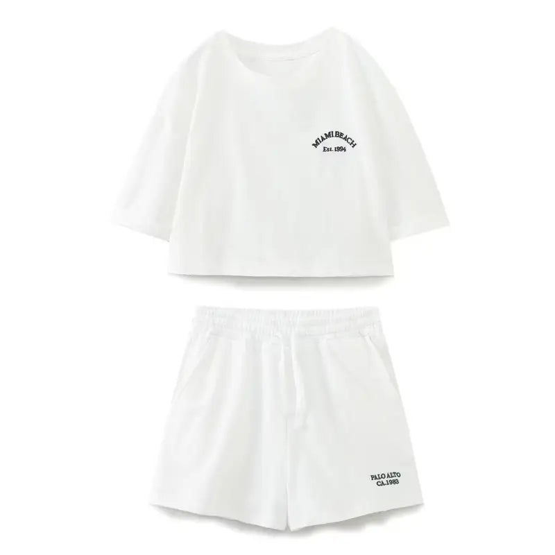White two-piece shorts set featuring casual cotton graphic top and Palo Alto set styling