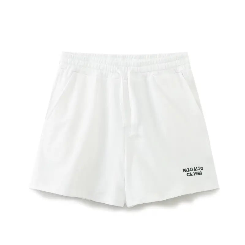 White athletic shorts from the Palo Alto Set featuring text flock design for summer style