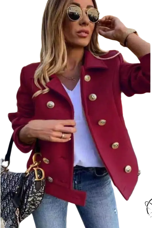 Burgundy double breasted jacket with gold buttons over white top and jeans