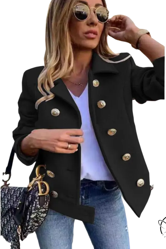 Black double-breasted jacket with gold buttons over white top and jeans