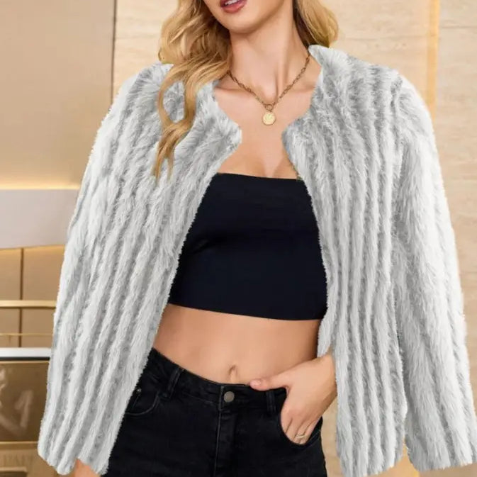 Faux fur overcoat styled with black crop top and jeans, ideal for fall and winter wear