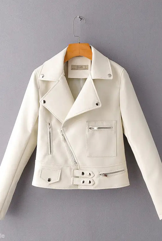 White faux leather biker jacket with silver zippers and belt for stylish fall/winter wear