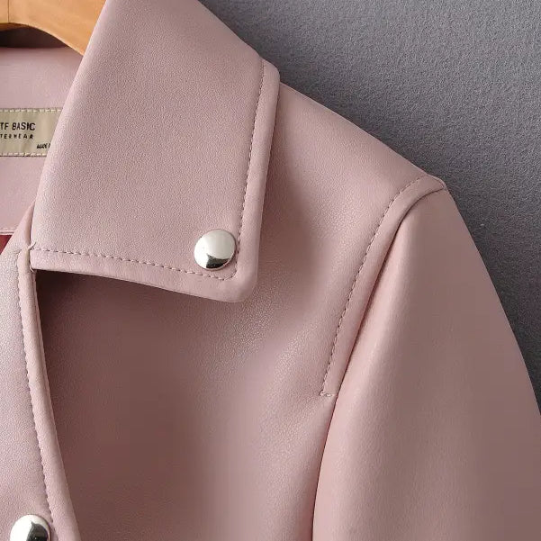 Pale pink washed faux leather biker jacket with silver snap buttons for fall winter wear