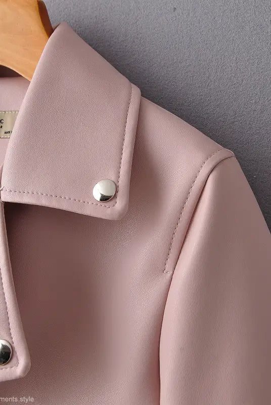 Pale pink washed faux leather biker jacket with silver snap buttons for fall winter wear