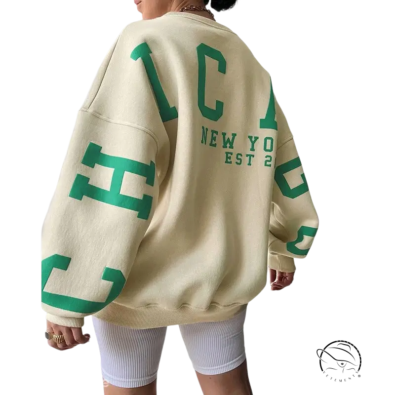 Oversized cream knitted graphic printed hoodie with green lettering