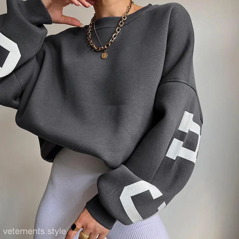 Gray cropped sweatshirt featuring white lettering from the Casual Knitted Graphic Printed Hoodie