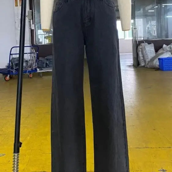 Black wide-leg denim jeans on a mannequin, showcasing casual light blue wide leg jeans with pockets