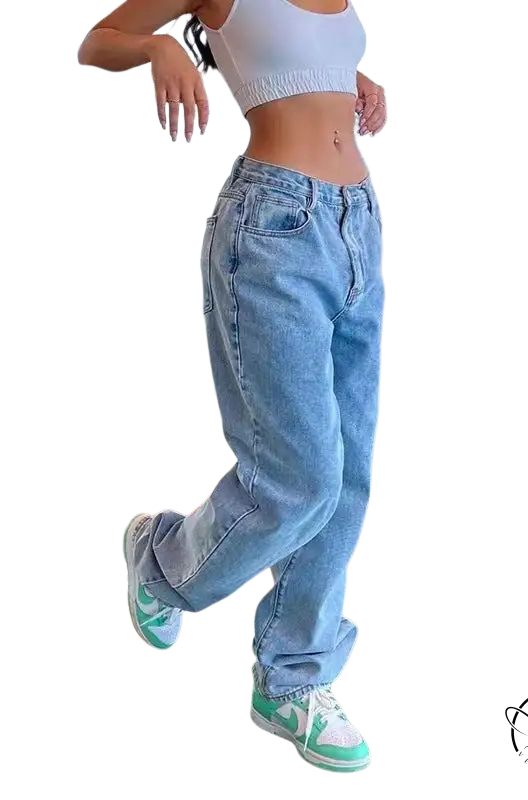 Person in wide leg light blue jeans, white crop top, mint green sneakers