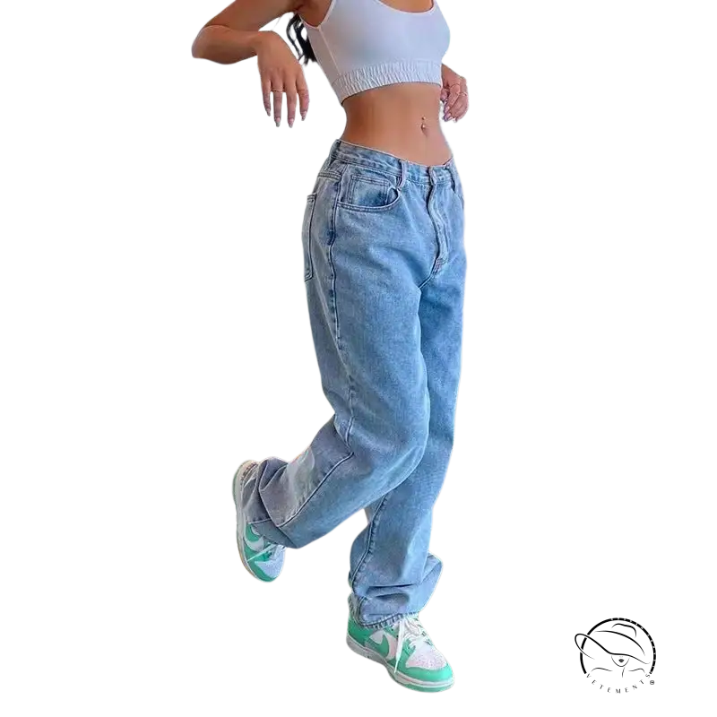 Person in wide leg light blue jeans, white crop top, mint green sneakers