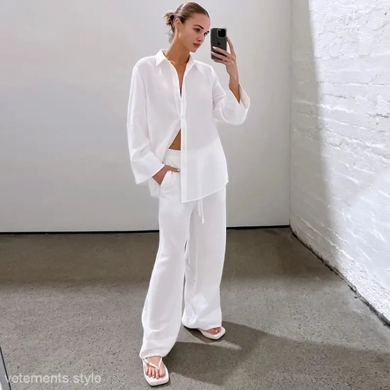 White linen pantsuit in pure cotton fabric, part of the long coat trousers set for spring fall