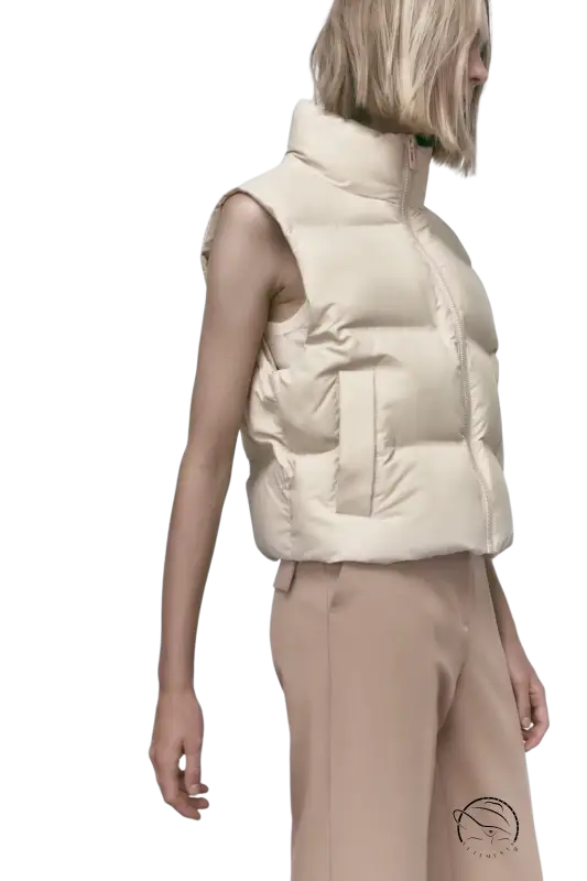 Beige puffer vest as casual loose short cotton jacket for autumn winter wear