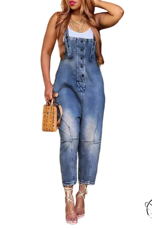Women’s dirty blue suspender jeans with nude stilettos and handbag