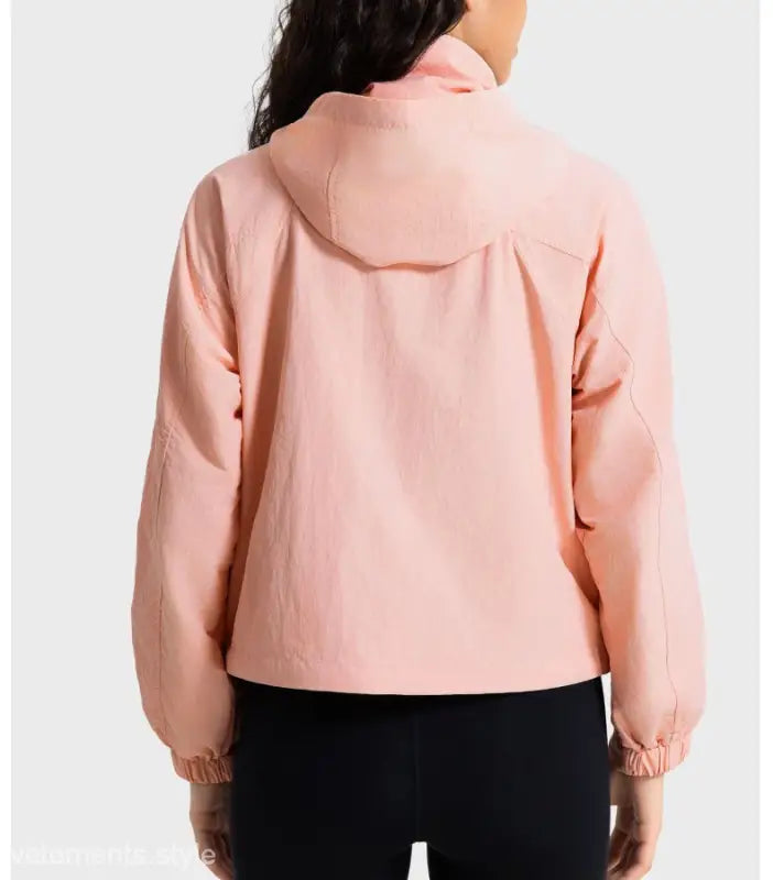 Peach-colored hooded jacket in pearlescent white albumin, perfect for casual wear