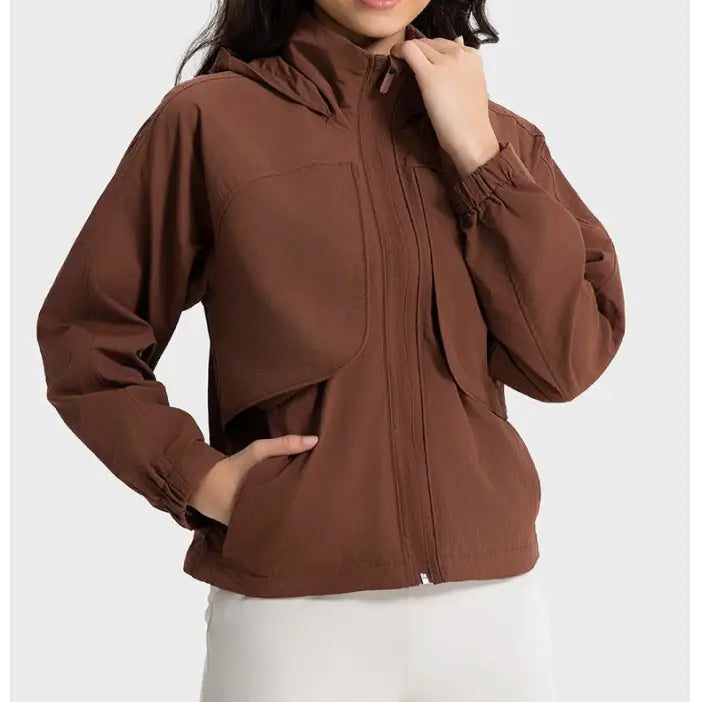 Brown hooded jacket in casual loose nylon outerwear, featuring pearlescent white albumin