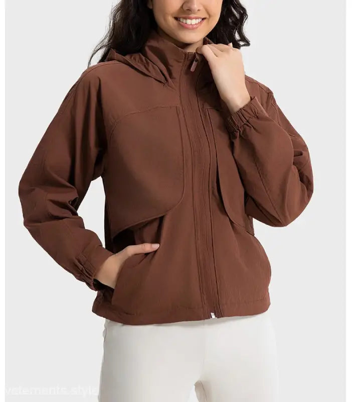 Brown hooded jacket in casual loose nylon outerwear, featuring pearlescent white albumin