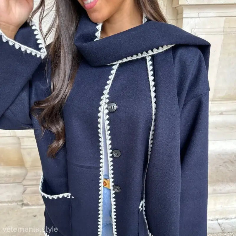 Navy blue coat with white scalloped trim and button closure, perfect as a scarf woolen coat