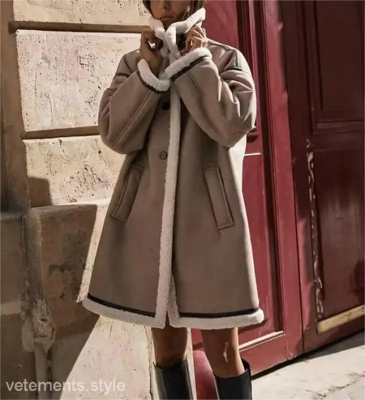 Beige shearling-lined winter fleece jacket with collar closure and pocket details