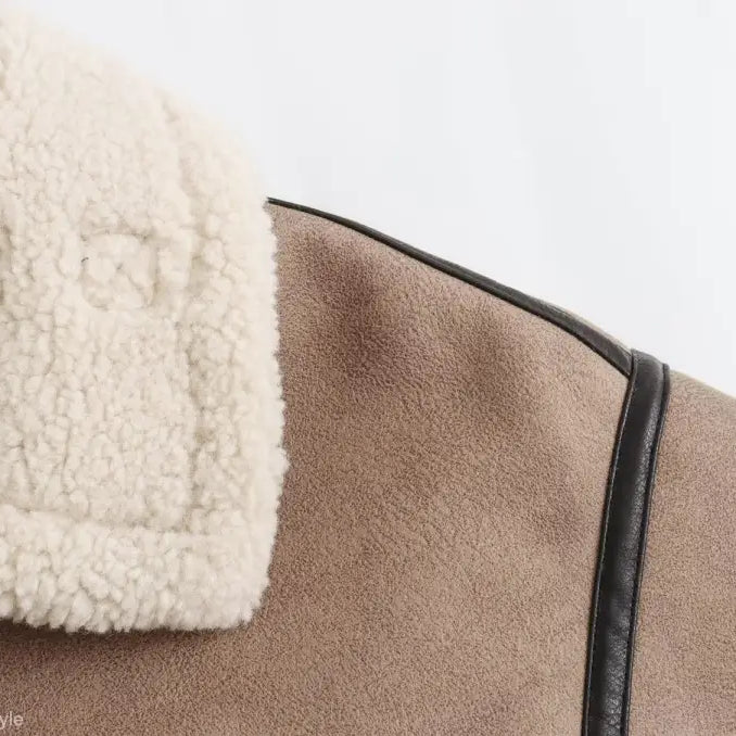 Tan winter fleece jacket with cream faux fur collar and button pocket closure