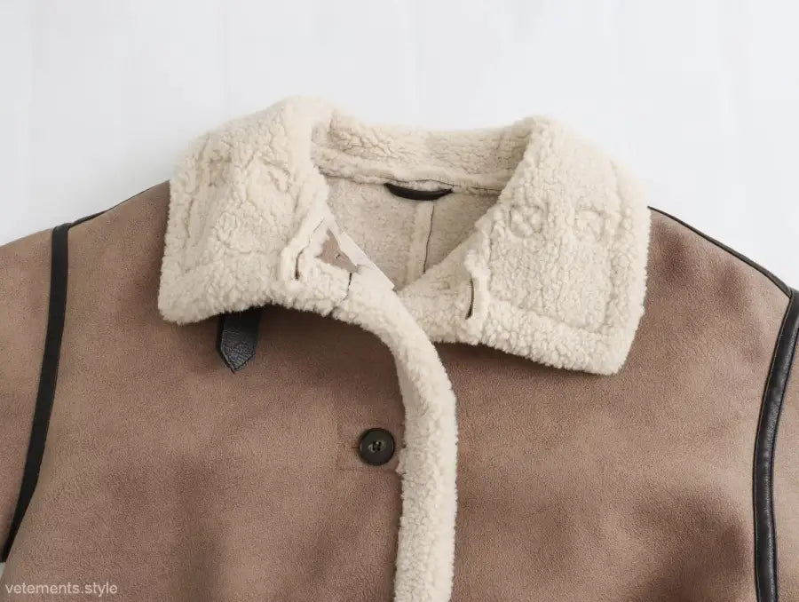 Brown casual winter fleece jacket with faux fur collar and button pocket closure