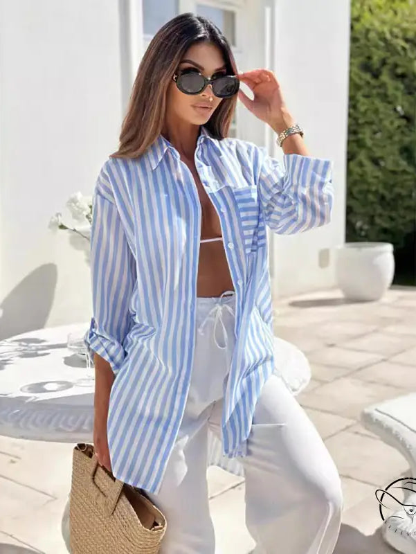Casual mid length shirt dress with blue and pink stripes and front pockets