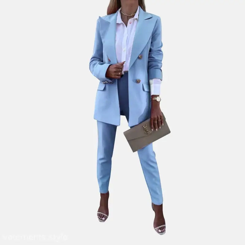 Light blue women’s suit with clutch for a spring casual office fit