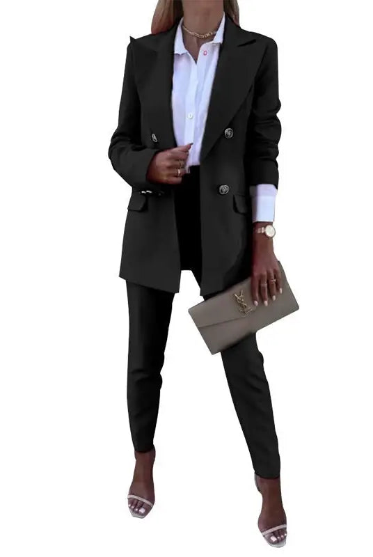 Woman’s black pantsuit with clutch for a stylish spring casual office fit