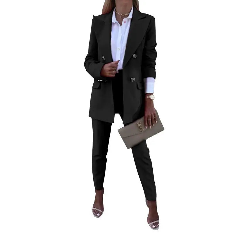 Woman’s black pantsuit with clutch for a stylish spring casual office fit