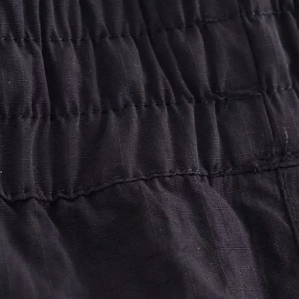 Black elastic waistband with visible stitching on Casual Short Bomber Jacket