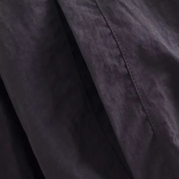 Dark gray short bomber jacket with pocket and tie stand collar detail