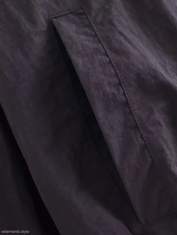 Dark gray short bomber jacket with pocket and tie stand collar detail