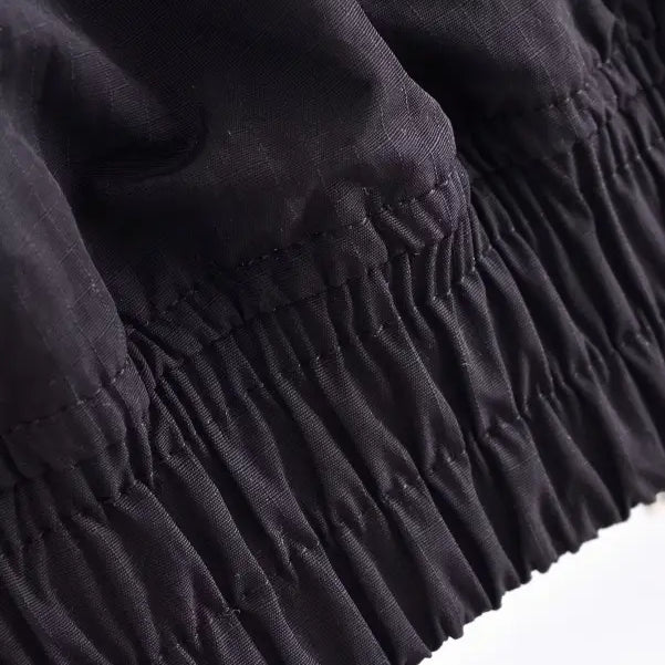 Detail of gathered edge on Casual Short Bomber Jacket showcasing elegant ruching