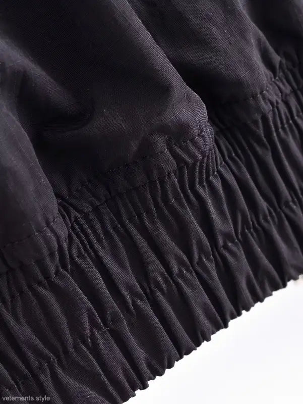 Detail of gathered edge on Casual Short Bomber Jacket showcasing elegant ruching