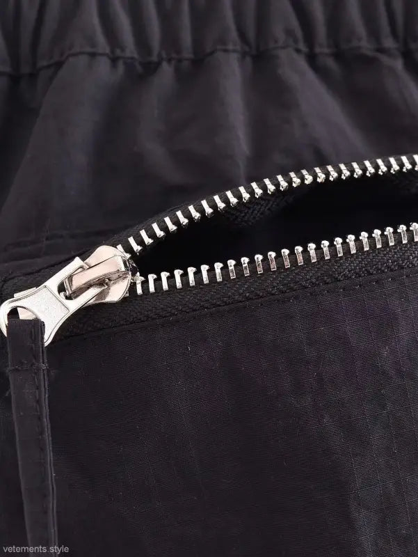 Metal zipper detail on a dark fabric Casual Short Bomber Jacket with Pocket and Tie Stand Collar
