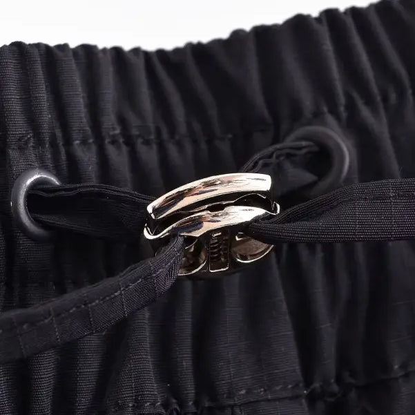Metallic clasp on gathered black fabric of Casual Short Bomber Jacket with Pocket