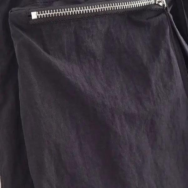 Zipper pocket detail on a Casual Short Bomber Jacket in dark fabric