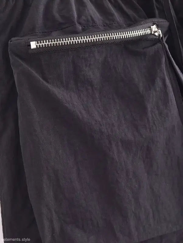 Zipper pocket detail on a Casual Short Bomber Jacket in dark fabric