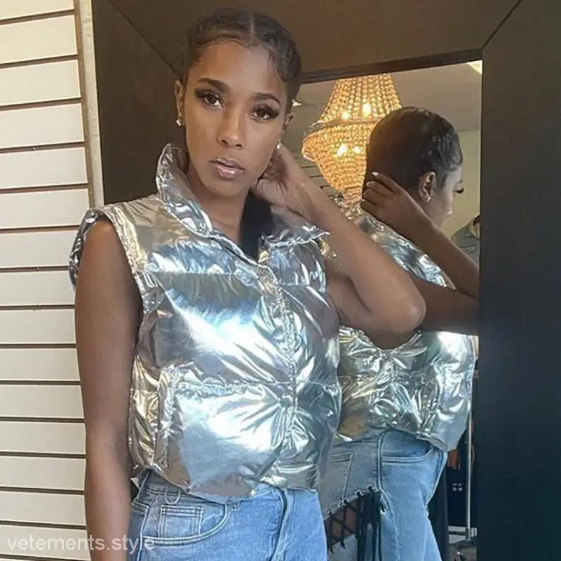 Shiny silver puffer vest exemplifying casual silver coat style in a winter short coat collection