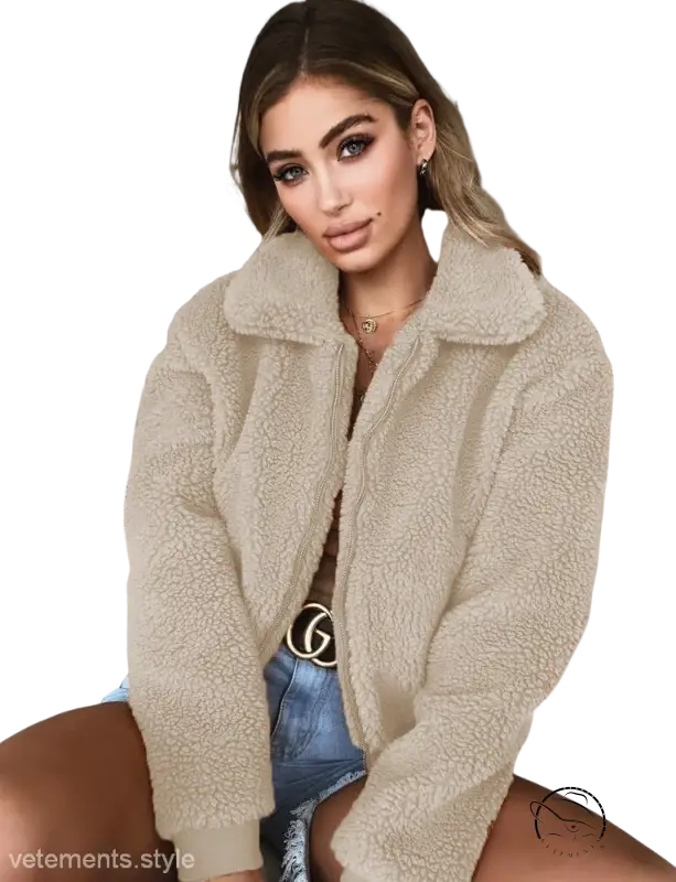Fluffy light gray teddy coat over denim shorts with belt