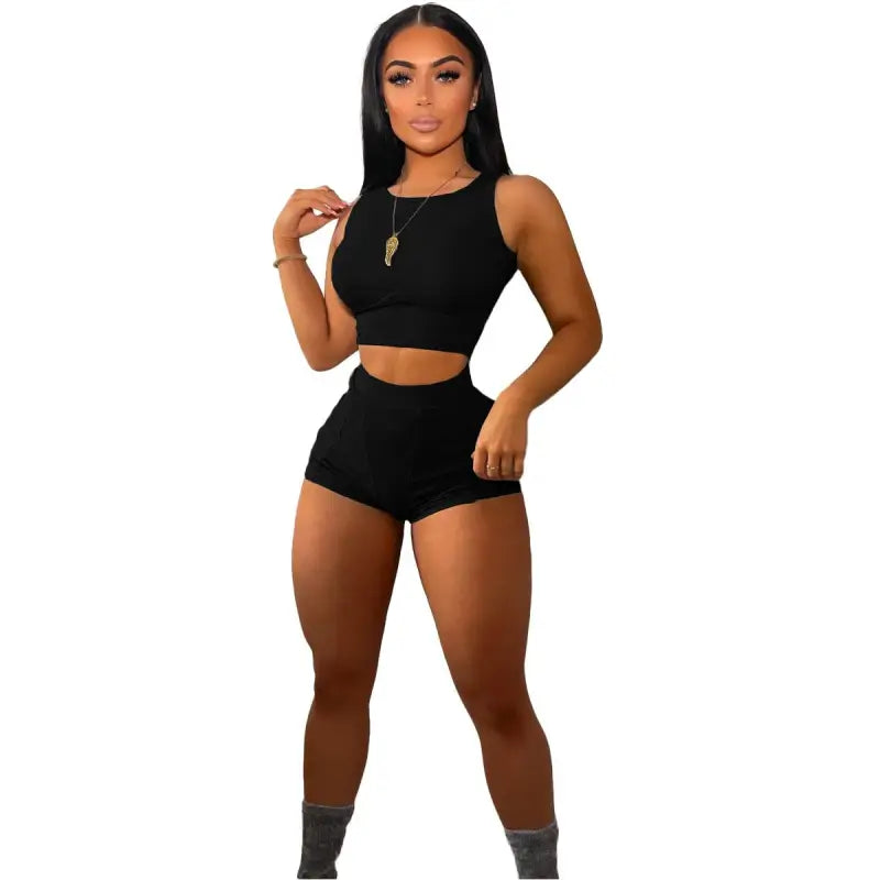 Black two-piece casual sports set for women with sleeveless crop top and high-waisted shorts