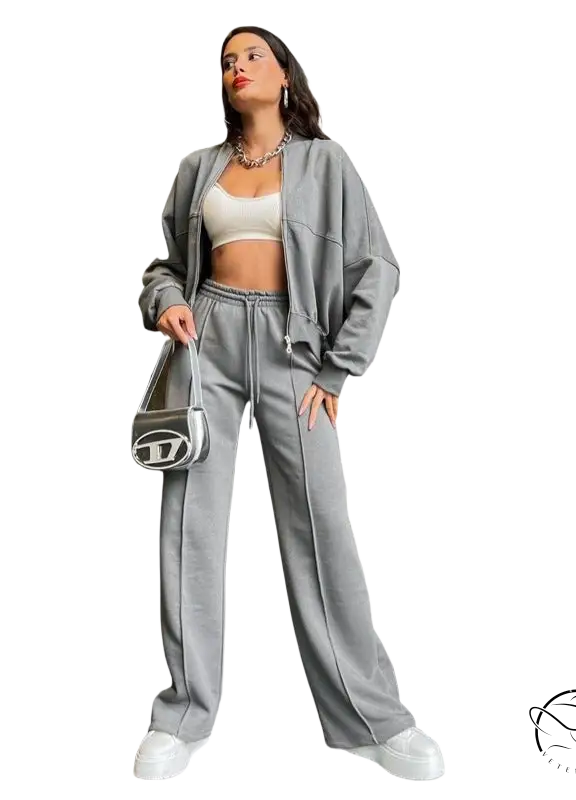 Woman in gray zipper cardigan sweater set with casual straight pants
