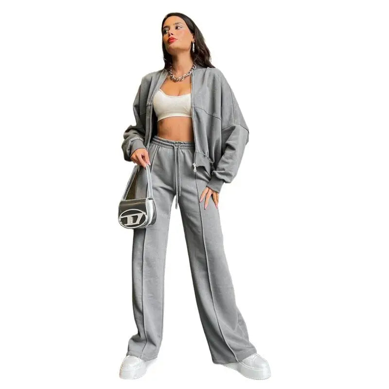 Woman in gray tracksuit featuring a casual zipper cardigan sweater and straight pants
