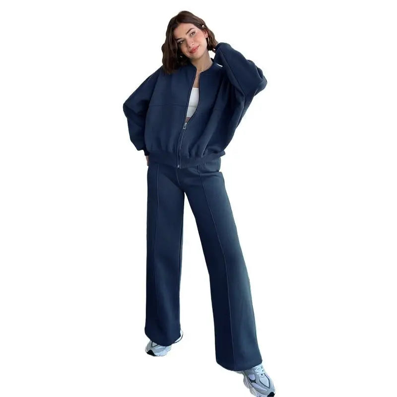 Woman in navy blue tracksuit featuring a casual zipper cardigan sweater set with straight pants
