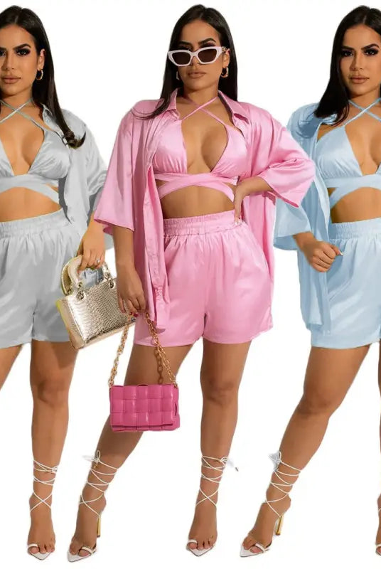 Three women wearing cheerful & cute satin shorts sets from the women clothing vest piece set