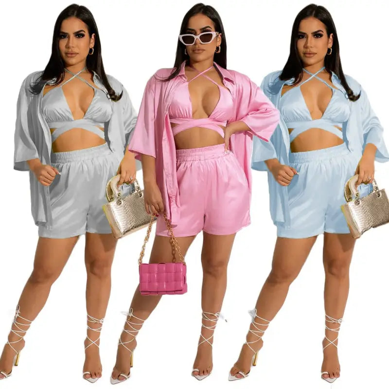 Three women wearing cheerful & cute satin shorts sets from the women clothing vest piece set